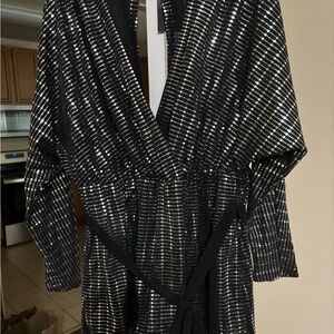 Slightly open back long sleeve romper from fashion nova . Size 1x